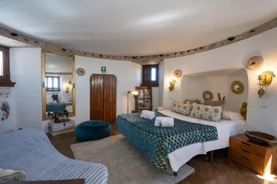 a bedroom with two beds and a couch at Bem Parece by Umbral in Albufeira