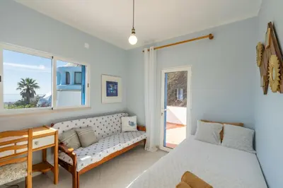a living room with a table and a couch at Bem Parece by Umbral in Albufeira