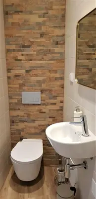 a bathroom with a white sink and a toilet at Casa da Mouraria in Faro
