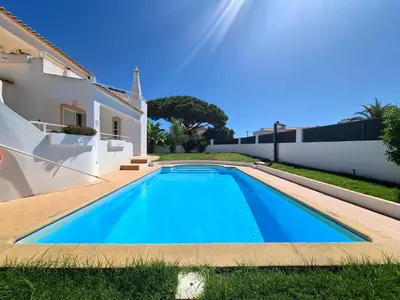 a bathroom with a white sink and a shower at Nightingale Villa in Albufeira