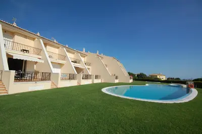 a large apartment building with a swimming pool at São Rafael Beach 300 m - Vila Rosal house in Albufeira