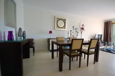 a dining room with a table and chairs at São Rafael Beach 300 m - Vila Rosal house in Albufeira
