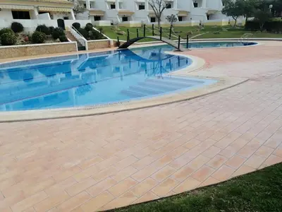 a swimming pool in the middle of a building at Beautiful Vila Rafaella, walk distance to beaches in Albufeira