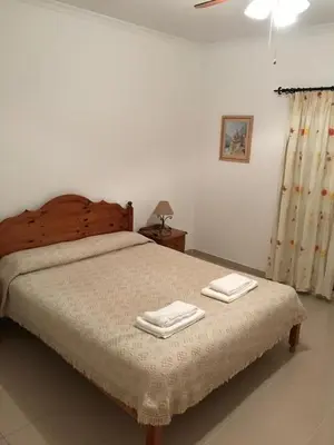 a bedroom with a bed with two towels on it at 4 bedroom town house Vale de Parra, close to Gale AT22 in Guia