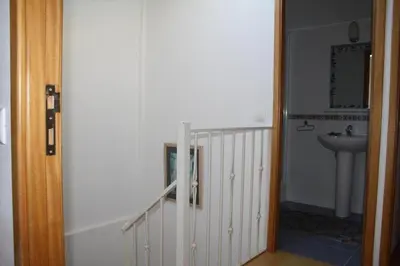 a hallway with a bathroom with a sink and a sink SUP H Hbestosbestos at 4 bedroom town house Vale de Parra, close to Gale AT22 in Guia