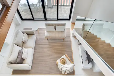 an overhead view of a living room with a couch and chair at Casa Pé na Areia- Unique Spot- Beach front by DreamvillasAlbufeira in Albufeira
