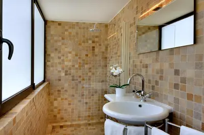 a bathroom with a sink and a mirror at Casa Pé na Areia- Unique Spot- Beach front by DreamvillasAlbufeira in Albufeira