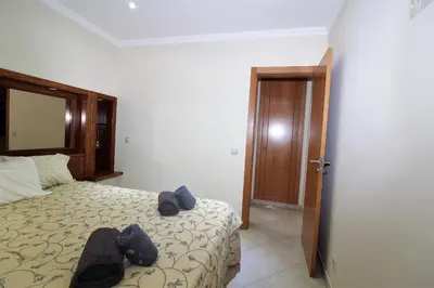 a bedroom with a bed with teddy bears on it at Beach Waves - Albufeira in Albufeira