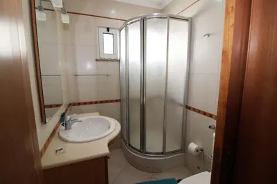 a bathroom with a shower and a sink at Beach Waves - Albufeira in Albufeira