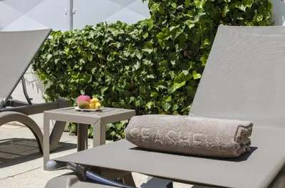 a patio with a table and chairs under a pergola at Villa Maresia in Galé