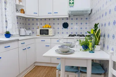 a shelf with two glass utensils and a coffee maker at Hillside Studio with Sea View & Fibre Internet in Albufeira
