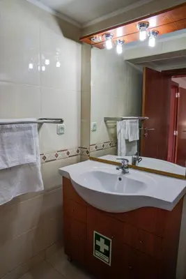 a bathroom with a sink and a mirror at CASA GRAZINA in Boliqueime