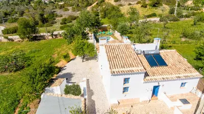 an aerial view of a house with a swimming pool at Villa Monte Algarvio - Private Heated Pool - wifi in Tunes