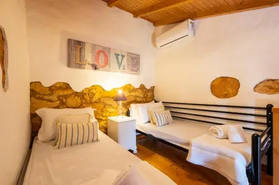 a bedroom with two beds in a room at Villa Monte Algarvio - Private Heated Pool - wifi in Tunes