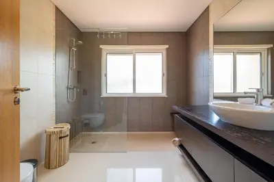 a bathroom with a sink and a shower and a toilet at VILLA SIBLING 2 in Vilamoura
