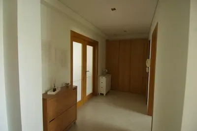 a room with a hallway with a dresser and a door at Vilamoura Condominio do Pinhal in Vilamoura
