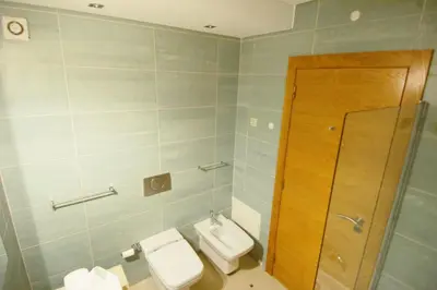 a bathroom with a toilet and a sink and a shower at Vilamoura Condominio do Pinhal in Vilamoura