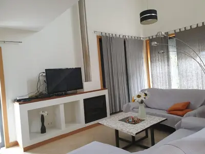 a living room with a couch and a tv at Albufeira Oura Beach V4 Villa Marisa with private Pool in Albufeira