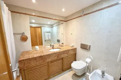 a kitchen with a sink and a microwave at MouraPraia By Garvetur in Vilamoura