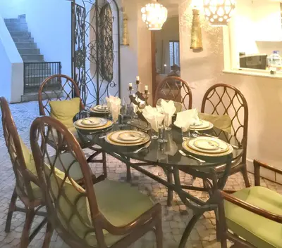 a dining room table with chairs and a tableasteryasteryasteryasteryasteryasteryastery at Elegant Villa in Vilamoura with Private Pool in Vilamoura