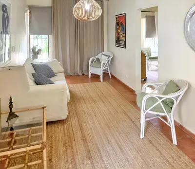 a living room with a couch and chairs at Elegant Villa in Vilamoura with Private Pool in Vilamoura