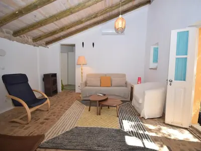 a bedroom with a bed and a bath tub at Delightful, authentic Quinta with pool in Loulé