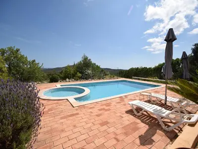 a bathroom with a mirror and a window at Delightful, authentic Quinta with pool in Loulé