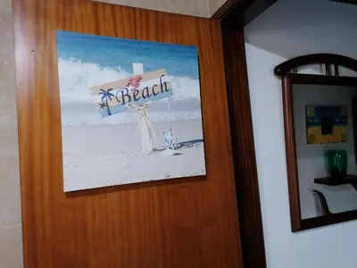 a picture of a cross on the door of a room at Vilamoura T1 com piscina - Mouramar I in Vilamoura