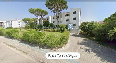 a building with a sign on the side of a road at Vilamoura T1 com piscina - Mouramar I in Vilamoura