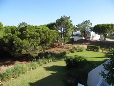 a living room with a couch and a table at Victory Village, Quinta do lago in Almancil
