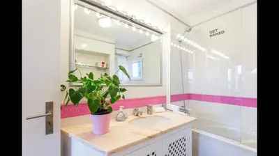 a bathroom with a sink and a potted plant at Apartment in Vilamoura (Marina) in Vilamoura