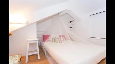 a bedroom with a bed with a mosquito net at Apartment in Vilamoura (Marina) in Vilamoura