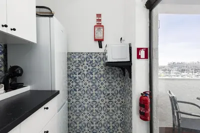 a small kitchen with a stove and a window at Marina Club - Sea front - Vilamoura in Vilamoura