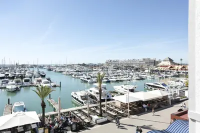 a marina filled with lots of boats in the water at Marina Club - Sea front - Vilamoura in Vilamoura