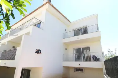 a white building with balconies on it at Lotus Villa V5 com piscina comum - Boliqueime, Algarve in Boliqueime
