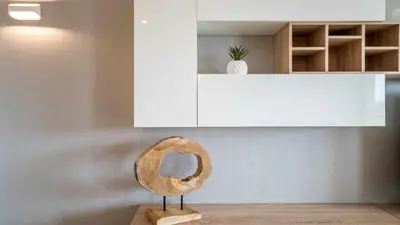 a wooden mirror sitting on a stand in a room at Marina Vilamoura Aquamar 220 By Vilamoura Sun in Quarteira