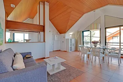a living room with a couch and a table at Marina Princess in Vilamoura