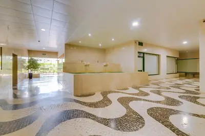 a lobby with a snake pattern on the floor at Tália II - City Center - Vilamoura in Vilamoura