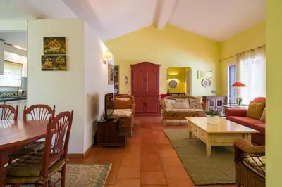 a stone circle with a fireplace in a park at BmyGuest - Falésia Beach Villa in Albufeira