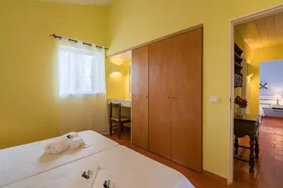 a bedroom with two beds and a window at BmyGuest - Falésia Beach Villa in Albufeira