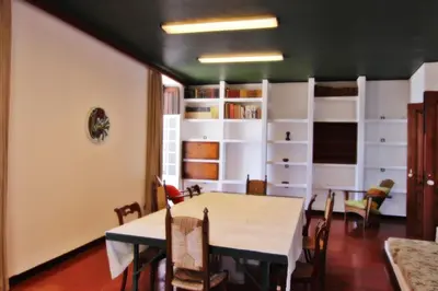 a dining room with a table and chairs at Casa dos Tios in Albufeira