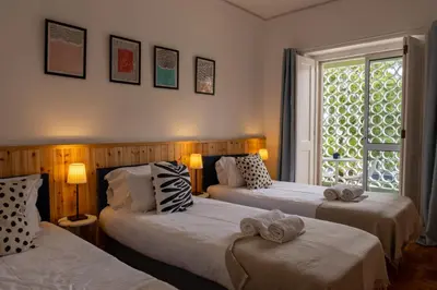 a bedroom with two beds with towels on them at Greenth Avenue in Faro
