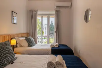 a bedroom with two beds and a window at Greenth Avenue in Faro