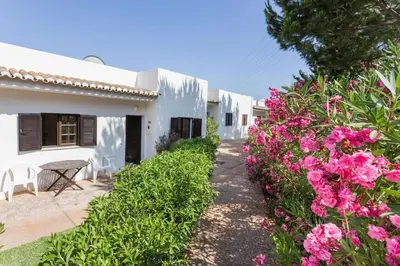 a small room with bunk beds and a bathroom at Albufeira Sunny Home for Families in Albufeira