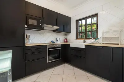 a bathroom with a sink and a tub and a mirror at Albufeira Sunny Home for Families in Albufeira