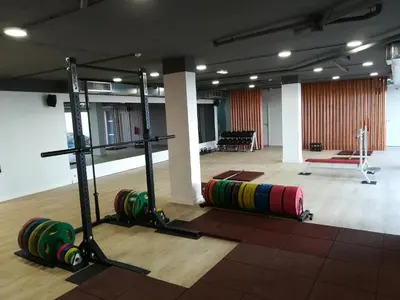 a room with a gym with a rack and two balls at Falésia Beach Villa by The Portuguese Butler in Olhos de Água