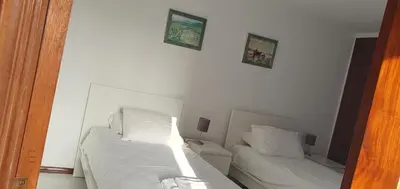 a bedroom with a large bed with two night stands at Penthouse with panoramic view in Vilamoura