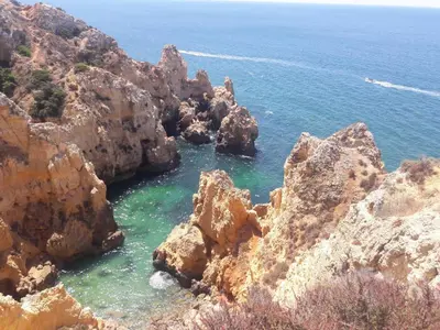 a group of rocks in the water near the ocean at Quinta Cosy in Paderne