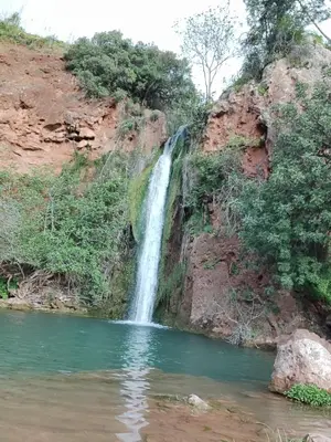 a waterfall on the side of a river at Quinta Cosy in Paderne