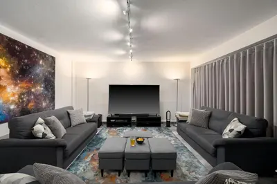 a living room with a couch and a flat screen tv at Villa Mebahel - Boliqueime in Boliqueime